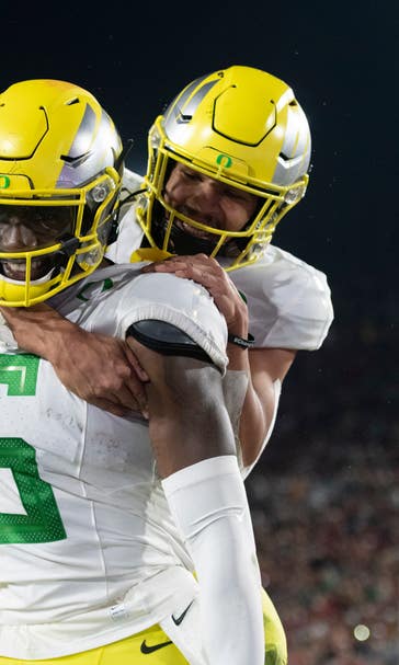 Herbert leads No. 7 Ducks past USC 56-24 to 8th straight win
